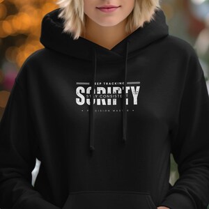 May include: Black hoodie with a white graphic that says "Keep Tracking - Scripty - Stay Consistent - Precision Master".