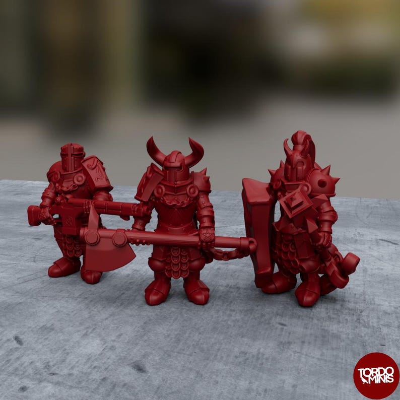 May include: Three red plastic miniature figures of warriors wearing armor and holding weapons. The figures are standing on a gray surface.