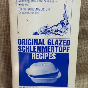 May include: A vintage cookbook cover with a blue and white design. The title reads "ORIGINAL GLAZED SCHLEMMERTOPF RECIPES" with the text "Slimming Meals are delicious - with the Glazed SCHLEMMERTOPF". A graphic of a clay pot is also featured.