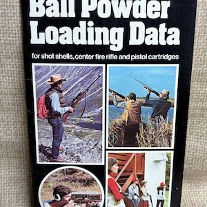 May include: A vintage "Winchester-Western Ball Powder Loading Data" book. The cover is black with white text and features images of people shooting rifles. The book is a revised edition from 9/78 and includes information for shot shells, center fire rifle, and pistol cartridges.
