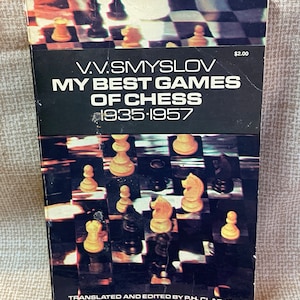 May include: A black and white book cover with a chessboard background and the title "V.V. SMYSLOV MY BEST GAMES OF CHESS 1935-1957" in white text. The book cover also includes the text "TRANSLATED AND EDITED BY PH. CLARKE" in white text.