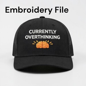 May include: Black trucker hat with the embroidered phrase "CURRENTLY OVERTHINKING" in white, above a cartoon brain in orange and yellow. The hat has a mesh back and a curved brim.