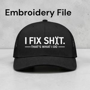 May include: Black trucker hat with the text "I FIX SH!T. - THAT'S WHAT I DO" in white. The hat has a mesh back and a curved brim. The words are centered on the front of the hat.
