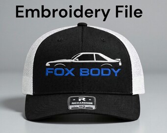 May include: Black and white trucker hat with a car silhouette and the words "FOX BODY" in blue. The hat also has the text "Embroidery File" at the top.