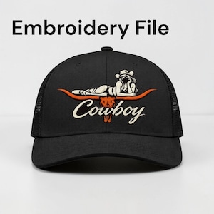 May include: Black trucker hat with a mesh back and a curved brim. The front features an embroidered design of a reclining woman in a cowboy hat, atop an orange steer horn, with the word "Cowboy" in white script. The text "Embroidery File" is above the hat.