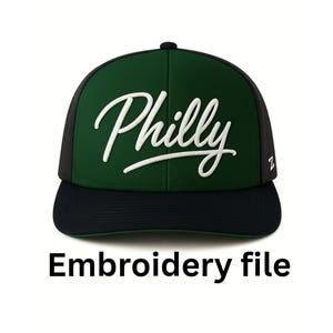 May include: A green and black baseball cap with the word "Philly" in white script across the front. The cap has a black brim and a mesh back. The text "Embroidery file" is below the cap.