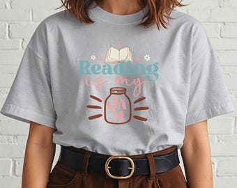 May include: A gray t-shirt with a graphic design that says "Reading is my jam" with a jar and an open book.