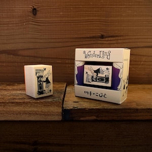 May include: A set of wooden rubber stamps featuring a rabbit in a dress. The stamps are packaged in a box with the words "Wonderland" and "ゆめのこびと" printed on it.