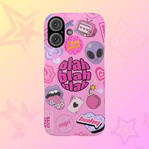 May include: Pink phone case with a variety of colorful stickers and graphics, including a mouth with a tongue sticking out, a heart, a bomb, a star, a TV, an alien, and the words "Stay Groovy", "Blah Blah Blah", "Sweet", "Baby", and "Angel Dust".