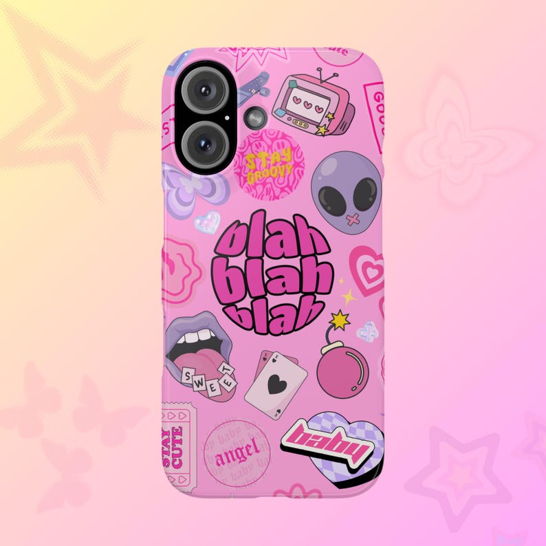 May include: Pink phone case with a variety of colorful stickers and graphics, including a mouth with a tongue sticking out, a heart, a bomb, a star, a TV, an alien, and the words "Stay Groovy", "Blah Blah Blah", "Sweet", "Baby", and "Angel Dust".