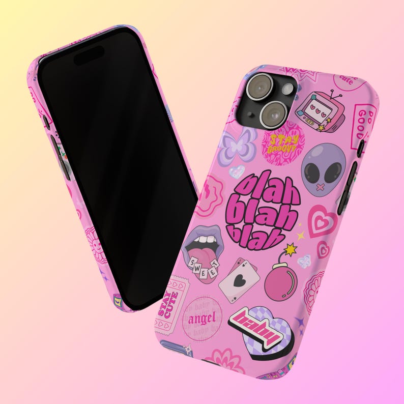 May include: Pink phone case with a variety of colorful stickers, including a butterfly, a heart, a bomb, a tongue, a playing card, a TV, an alien, and the words "blah blah blah".