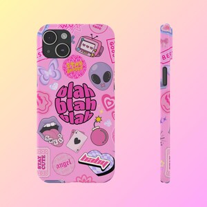 May include: Pink phone case with a variety of colorful stickers and graphics, including a heart, a bomb, a butterfly, a mouth, a playing card, a television, an alien, and the words "blah blah blah".