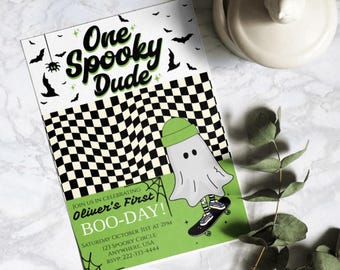 May include: A green and white Halloween party invitation with a ghost wearing a green beanie and skateboarding. The text reads "One Spooky Dude Oliver's First Boo-Day!" with details about the party.