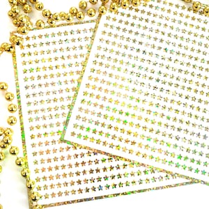 Extra Small Gold Star Stickers, set of 600 micro sized golden star vinyl stickers for journals, notebooks, planners and goal trackers