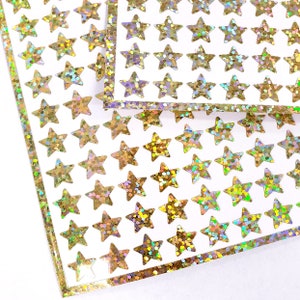 Gold stars  Sticker for Sale by avasart