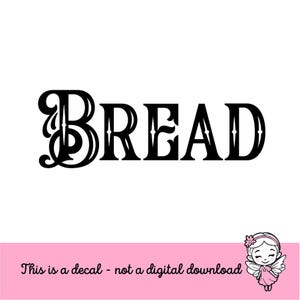 May include: Black decal with the word "BREAD" in a decorative font. The text is centered on a white background. Below the text is a pink banner with the text "This is a decal - not a digital download" and a cartoon fairy.