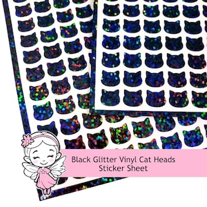 May include: A sticker sheet featuring rows of black cat head shapes with a holographic glitter finish. The stickers are arranged in a grid pattern on a white backing. The text on the image reads Black Glitter Vinyl Cat Heads Sticker Sheet.