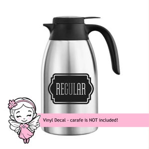 May include: A stainless steel thermal carafe with a black plastic lid and handle. A black rectangular label with decorative corners is applied to the front, featuring the word REGULAR in white capital letters. A pink banner states Vinyl Decal.
