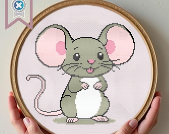 May include: A cross-stitch pattern of a cute gray mouse with pink ears and a white belly. The mouse is standing on its hind legs with its front paws raised. The background is a light pink.