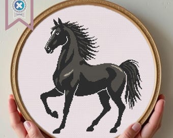 May include: Black horse cross stitch pattern in a round embroidery hoop. The horse is in a standing pose with its head turned to the side.