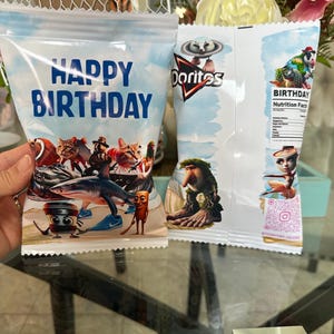 May include: Two white bags with colourful cartoon characters and the words "Happy Birthday" and "Doritos" printed on them.