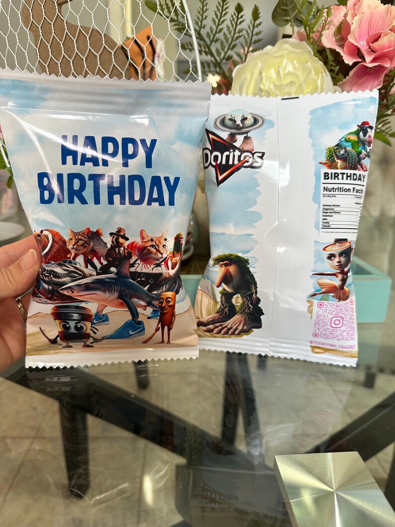 May include: Two white bags with colourful cartoon characters and the words "Happy Birthday" and "Doritos" printed on them.