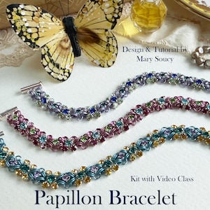 May include: Three colorful bracelets with intricate floral designs and sparkling gemstones. The bracelets are in shades of blue, purple, and pink. The image also includes a butterfly and the text "Papillon Bracelet".