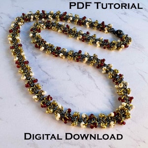 May include: A necklace made with small gold, silver, and red beads. The necklace is on a white marble surface. The text "PDF TUTORIAL" and "DIGITAL DOWNLOAD" is visible in the image.