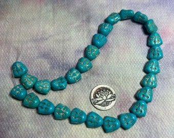 Magnesite or Howlite  Buddha Head Shape Turquoise colored Bead Strand