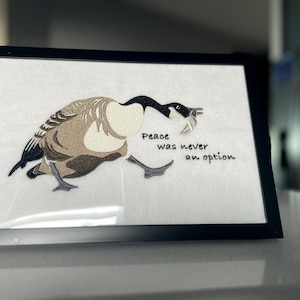 Goose with knife embroidery on felt, framed wall art – Canadian goose meme.