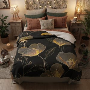 May include: A bed with a black floral comforter featuring gold and white outlines. The bed is adorned with various pillows in shades of green, rust, and beige. Two wooden nightstands with lamps flank the bed, creating a cozy, inviting bedroom scene.