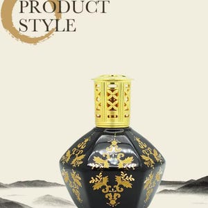 May include: Black decorative fragrance lamp with gold filigree accents. The lamp has a gold-colored top and a geometric shape. The text "PRODUCT STYLE" is in the upper left corner.
