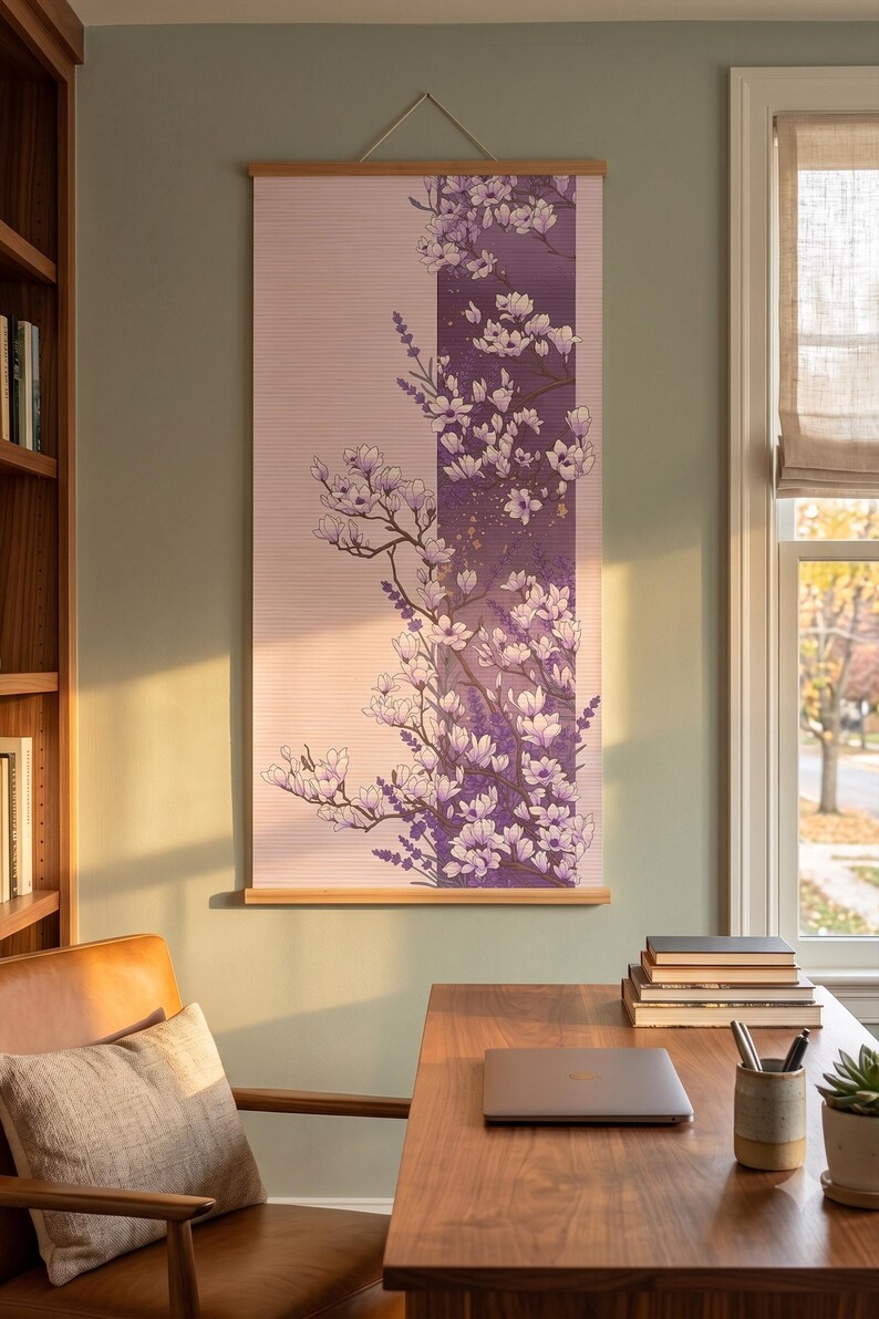 May include: A vertical wall hanging featuring a floral illustration of white magnolia blossoms and purple lavender sprigs. The artwork is printed on a light pink background with a dark purple vertical stripe, suspended by wooden rods at the top and bottom.