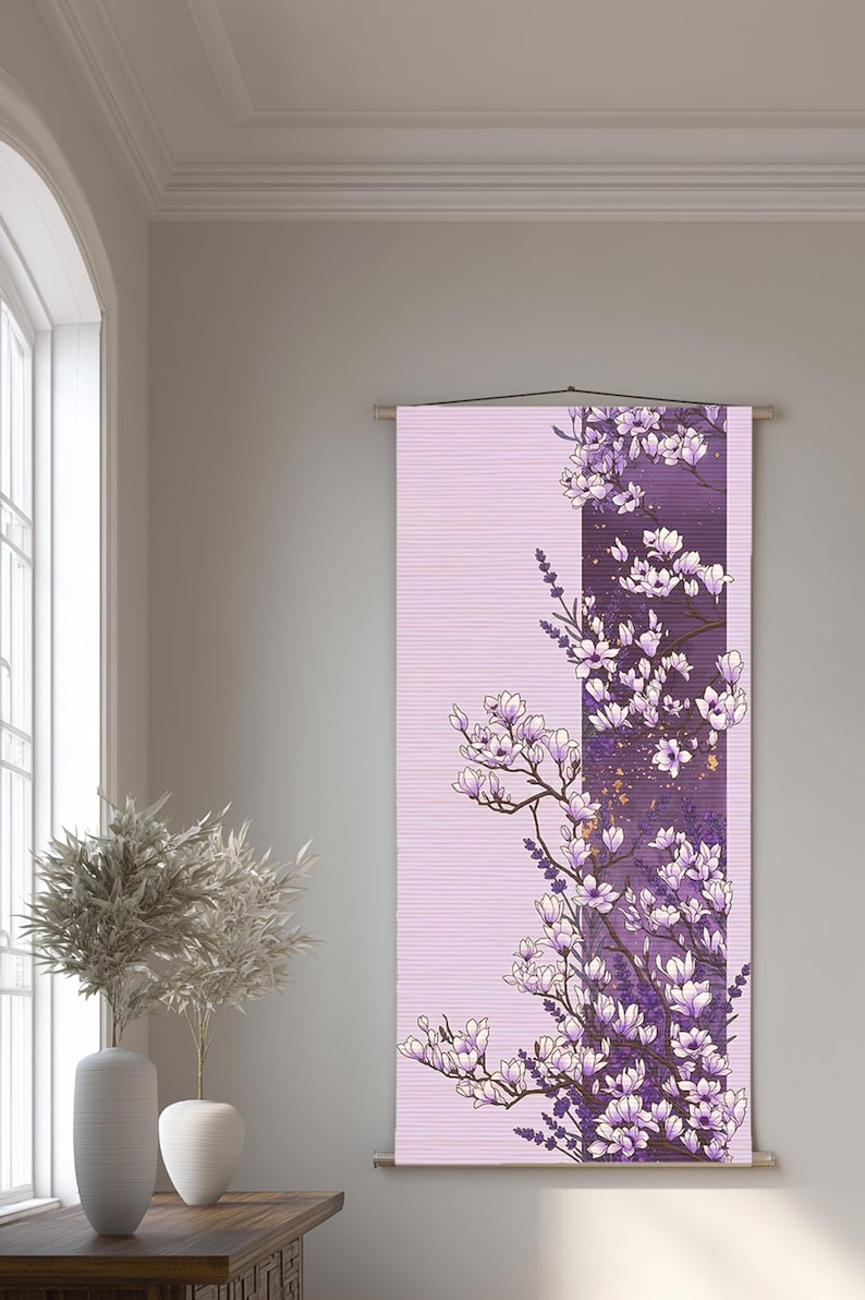 May include: A vertical wall hanging tapestry featuring a light lavender background with a central dark purple panel. The design displays a detailed illustration of blooming white and purple magnolia flowers and lavender sprigs with gold accents.