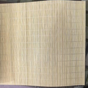 May include: A light beige bamboo blind featuring thin, vertical slats held together by fine, evenly spaced horizontal threads. The material has a natural, fibrous texture with subtle variations in color, showcasing a clean, linear pattern.