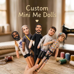 May include: Five custom fabric dolls featuring printed photographic faces and bodies, held together in a hand. The dolls wear various outfits including a white graphic t-shirt, a grey top, a black suit, a white long-sleeve shirt, and a floral print outfit.