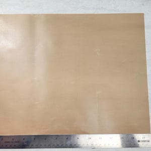 May include: A plain, light brown sheet of paper.