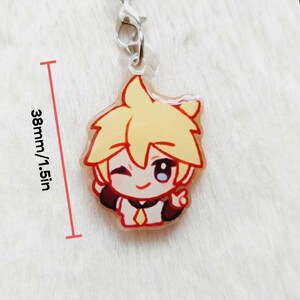 May include: A clear acrylic charm featuring a cartoon character with yellow hair and a red outline. The character is winking and giving a peace sign. The charm is 1.5 inches (38mm) in height and has a silver clasp.