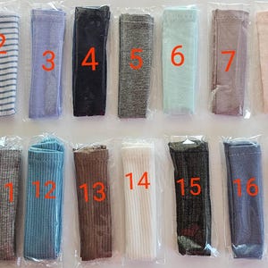May include: A set of 17 different colored fabric strips, each with a number from 1 to 17. The fabric strips are arranged in two rows, with the first row containing strips 1 through 9 and the second row containing strips 10 through 17.