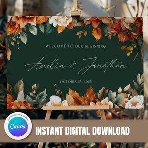 May include: A wedding welcome sign with a green background and floral accents in shades of orange, white, and green. The text reads "Welcome to our beginning Amelia & Jonathan October 25, 2025".