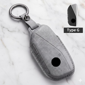 Funda para llavero de BMW hecha a mano en cuero y alcántara