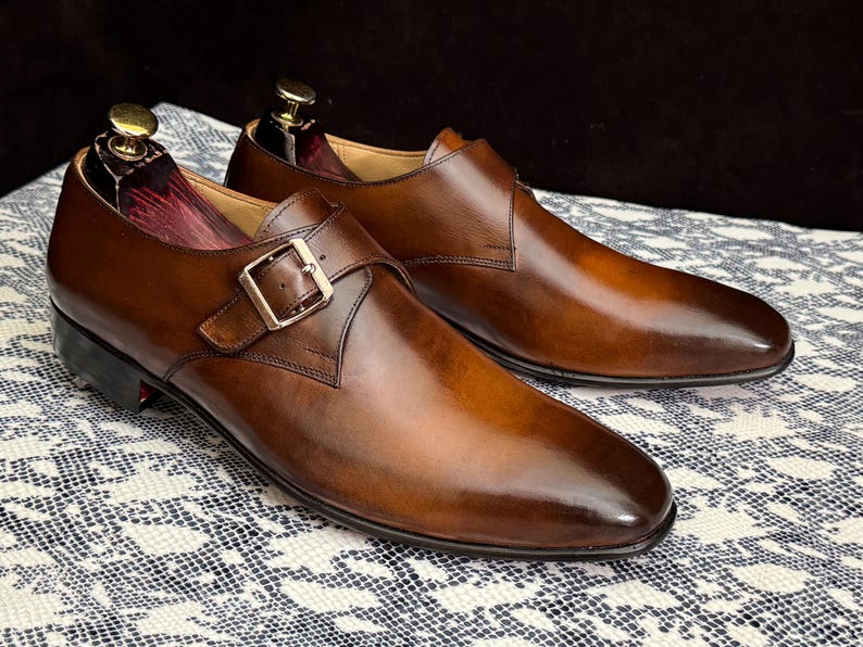 Handmade men's brown single monk strap dress shoes, crafted from premium cowhide leather with Goodyear welt construction, bespoke footwear for timeless style and durability