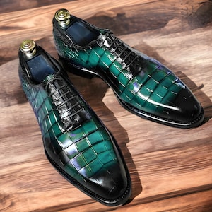 Handmade men's  alligator leather Oxford shoes featuring an exotic textured finish, lace-up closure, and a sleek silhouette for a luxury formal look.
