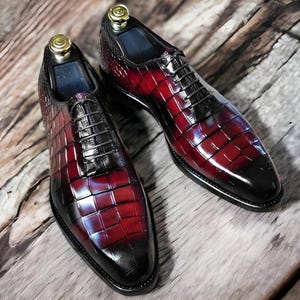 Handmade men's  alligator leather Oxford shoes featuring an exotic textured finish, lace-up closure, and a sleek silhouette for a luxury formal look.