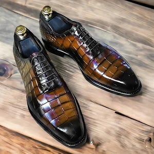 Handmade men's  alligator leather Oxford shoes featuring an exotic textured finish, lace-up closure, and a sleek silhouette for a luxury formal look.
