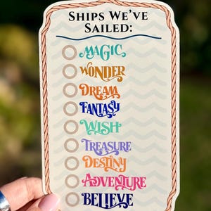 May include: A cream-colored sticker with the text "SHIPS WE'VE SAILED:" above a list of ship names in various colors. The names include MAGIC, WONDER, DREAM, FANTASY, WISH, TREASURE, DESTINY, ADVENTURE, and BELIEVE.