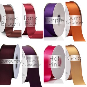 May include: Eight spools of satin ribbon in various colors, including chocolate brown, dark red, purple, burnt orange, burgundy, eggplant plum aubergine, hot pink, and gold.