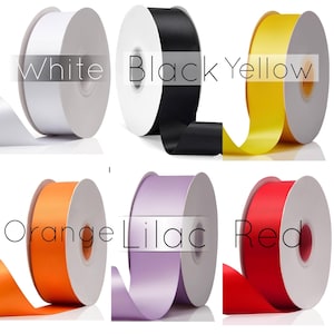 May include: Six spools of ribbon in different colors: white, black, yellow, orange, lilac, and red. Each spool has a label with the color name.