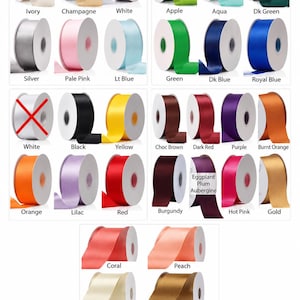 May include: A satin ribbon color chart displaying numerous spools of ribbon in various colors including ivory, champagne, white, apple, aqua, dark green, silver, pale pink, light blue, green, dark blue, royal blue, black, yellow, brown, red, and gold.