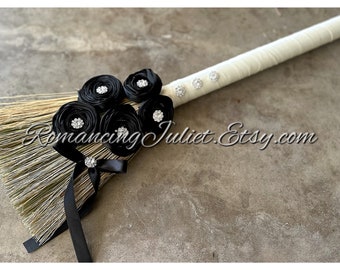 Timeless Elegance Wedding Broom with Vibrant Crystal Accents and Delicate Hand Rolled Rosettes.. Shown in Ivory with Black Rosettes